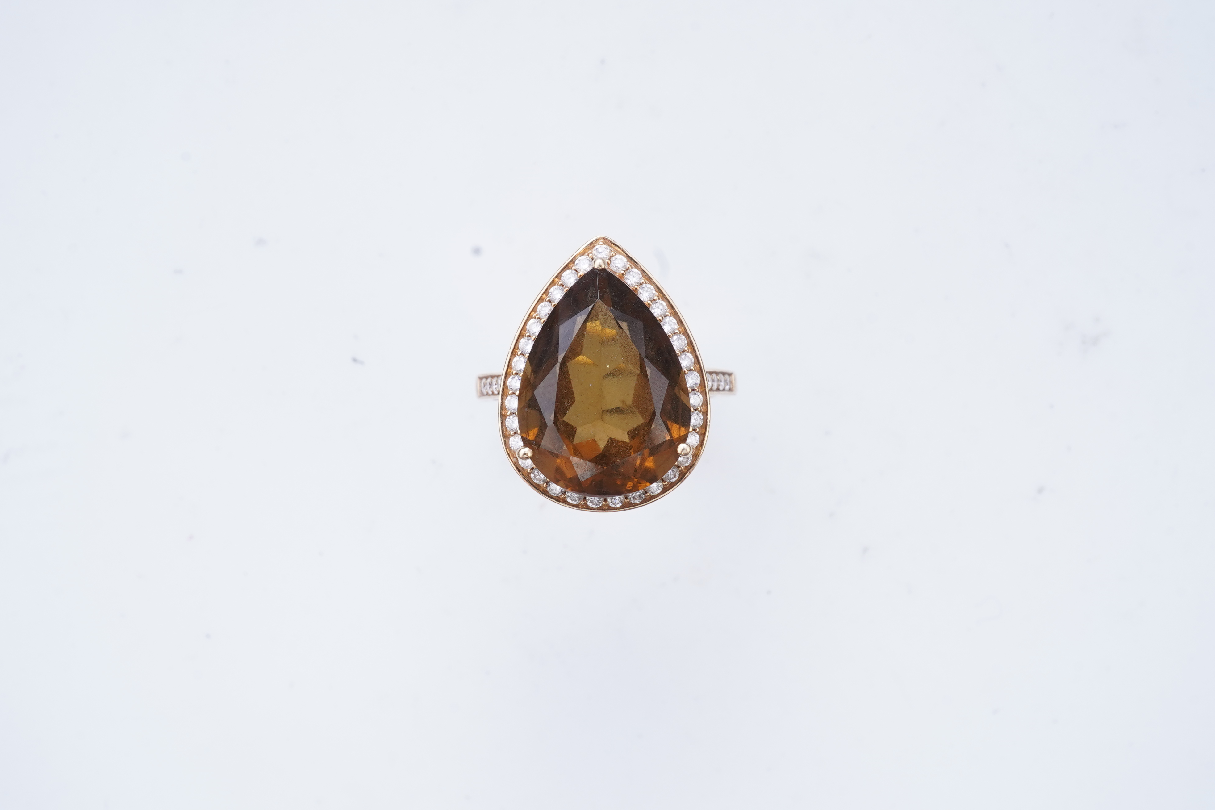 A smoky quartz and diamond ring